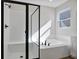 Spa-like bathroom with shower and soaking tub at 4043 Bannock Ave, Tavares, FL 32778