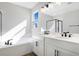 Modern bathroom with double vanity, soaking tub, and walk-in shower at 4043 Bannock Ave, Tavares, FL 32778