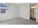 Spacious bedroom with carpet and en-suite bathroom access at 4043 Bannock Ave, Tavares, FL 32778