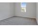Simple bedroom with gray carpet and a window at 4043 Bannock Ave, Tavares, FL 32778