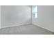 Empty bedroom with gray carpet and a window at 4043 Bannock Ave, Tavares, FL 32778