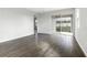 Spacious Gathering room with tile flooring and sliding glass doors to backyard at 6357 Clover St, Lake Hamilton, FL 33851