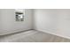 Bright bedroom with neutral walls and carpeted floor at 6357 Clover St, Lake Hamilton, FL 33851