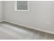 Simple bedroom with grey carpet and a window at 6357 Clover St, Lake Hamilton, FL 33851