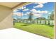 Covered patio overlooking backyard at 3120 Kacee Dr, Eagle Lake, FL 33839