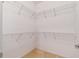 Walk-in closet with wire shelving and hanging rods at 694 Irvine Ranch Rd, Kissimmee, FL 34759