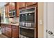 Updated kitchen with stainless steel double oven and microwave at 694 Irvine Ranch Rd, Kissimmee, FL 34759