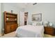 Bedroom with wooden furniture and window at 694 Irvine Ranch Rd, Kissimmee, FL 34759