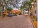 Brick-paved streets and golf carts parked in the community at 694 Irvine Ranch Rd, Kissimmee, FL 34759
