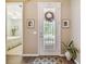 Inviting entryway with decorative door and view of bedroom at 694 Irvine Ranch Rd, Kissimmee, FL 34759