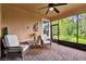 Peaceful screened patio with comfortable wicker chairs at 694 Irvine Ranch Rd, Kissimmee, FL 34759