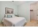 Bedroom with white bedding and walk-in closet at 694 Irvine Ranch Rd, Kissimmee, FL 34759