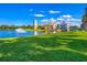 Community with lakefront clubhouse and fountain at 694 Irvine Ranch Rd, Kissimmee, FL 34759