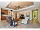 Spacious living area with built-in shelving and a fireplace at 694 Irvine Ranch Rd, Kissimmee, FL 34759