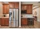 Stainless steel refrigerator and wine cooler in this updated kitchen at 694 Irvine Ranch Rd, Kissimmee, FL 34759