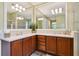 Bathroom with a double vanity and large mirror at 694 Irvine Ranch Rd, Kissimmee, FL 34759