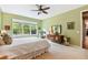 Bedroom with a queen bed, dresser, and large window at 694 Irvine Ranch Rd, Kissimmee, FL 34759