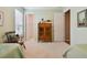 Bright bedroom with twin beds, built-in storage, and access to a bathroom at 694 Irvine Ranch Rd, Kissimmee, FL 34759