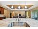 Kitchen island with sink and a view into the living room at 694 Irvine Ranch Rd, Kissimmee, FL 34759