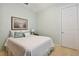 Serene bedroom with white bedding and wall art at 694 Irvine Ranch Rd, Kissimmee, FL 34759