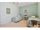 Spacious bedroom with twin beds and light-blue walls at 694 Irvine Ranch Rd, Kissimmee, FL 34759