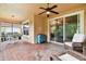 Covered patio with brick flooring and access to kitchen at 694 Irvine Ranch Rd, Kissimmee, FL 34759