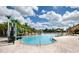 Inviting pool area with a waterslide and plenty of lounge chairs at 2955 Beach Palm Ave, Kissimmee, FL 34747
