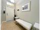 Inviting entryway with a bench, coat rack, and tasteful wall art at 2955 Beach Palm Ave, Kissimmee, FL 34747