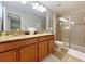 Double vanity bathroom with granite countertop, shower, and tile flooring at 2955 Beach Palm Ave, Kissimmee, FL 34747