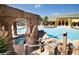 Relaxing resort-style pool with a grotto and waterfall feature at 2955 Beach Palm Ave, Kissimmee, FL 34747