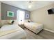 Bright bedroom with two twin beds, wood floors, and plenty of natural light at 2955 Beach Palm Ave, Kissimmee, FL 34747