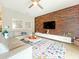 Light and airy living room with a comfortable sectional sofa and stylish decor at 2955 Beach Palm Ave, Kissimmee, FL 34747