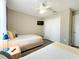 Bedroom with two twin beds, a TV, and plenty of closet space at 2955 Beach Palm Ave, Kissimmee, FL 34747