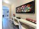 Fun game room with a long table and colorful wall art at 2955 Beach Palm Ave, Kissimmee, FL 34747