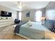 King-size bed, stylish decor, and large TV in this main bedroom at 2955 Beach Palm Ave, Kissimmee, FL 34747