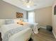 Bedroom with twin beds, wood floors, and blue and white bedding at 2955 Beach Palm Ave, Kissimmee, FL 34747