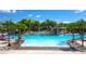 Large community pool with waterfall and plenty of space for swimming at 2955 Beach Palm Ave, Kissimmee, FL 34747
