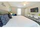 King-size bed, stylish decor, and built-in workspace in bedroom at 2955 Beach Palm Ave, Kissimmee, FL 34747