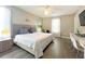 King-size bed, stylish decor, and built-in workspace in bedroom at 2955 Beach Palm Ave, Kissimmee, FL 34747