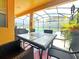 Enjoy meals outdoors with this patio furniture next to the pool at 2955 Beach Palm Ave, Kissimmee, FL 34747