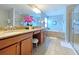 Double vanity bathroom with granite countertop, soaking tub, and shower at 2955 Beach Palm Ave, Kissimmee, FL 34747