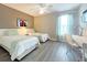 Bedroom featuring two twin beds, a desk, and cheerful decor at 2955 Beach Palm Ave, Kissimmee, FL 34747