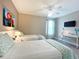 Bedroom with two twin beds, a desk, and Merida wall art at 2955 Beach Palm Ave, Kissimmee, FL 34747