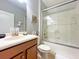 Clean bathroom with tub/shower, vanity, and Mickey Mouse decor at 2955 Beach Palm Ave, Kissimmee, FL 34747