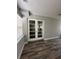 Bright dining room with double French doors and wood-look floors at 1541 N Hudson St, Orlando, FL 32808