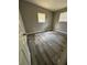 Spacious bedroom with wood-look floors and neutral walls at 1541 N Hudson St, Orlando, FL 32808