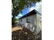 White house exterior with black accents, surrounded by lush trees at 1541 N Hudson St, Orlando, FL 32808