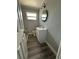 Updated bathroom with white vanity and stylish tile at 1541 N Hudson St, Orlando, FL 32808