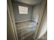 Bright bedroom with wood-look floors and window coverings at 1541 N Hudson St, Orlando, FL 32808