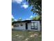 Newly painted ranch home with a modern look and landscaping at 1541 N Hudson St, Orlando, FL 32808